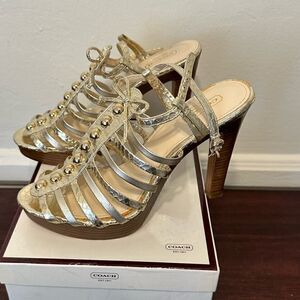 Coach  platform heel  leather sandal  in gold size 7